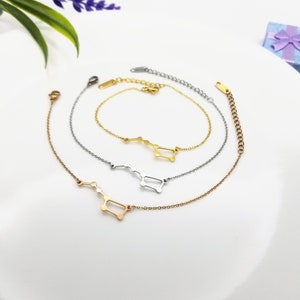May include: Three gold, silver, and rose gold constellation bracelets with a delicate chain and a constellation design. The constellation is the Ursa Major constellation.