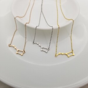 May include: Three delicate necklaces with a constellation design. The necklaces are silver, gold, and rose gold.