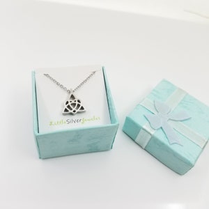 May include: A silver Celtic knot pendant necklace in a light blue gift box with a white ribbon. The box has the text "LittleSilverjeweler" printed on it.