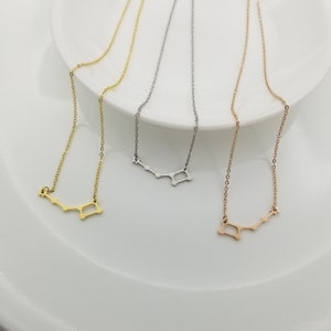 May include: Three delicate necklaces with a constellation design. The necklaces are available in gold, silver, and rose gold.