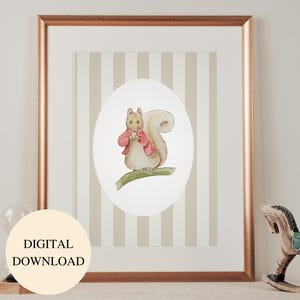 May include: A framed watercolor print featuring a squirrel in a red jacket holding a cup, set against a striped background. The print is in a gold frame and includes the text "DIGITAL DOWNLOAD" in a circular label.
