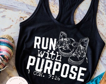 May include: Black tank top with white text that reads "Run with Purpose 1 Cor. 9:26" and a graphic of two sneakers.