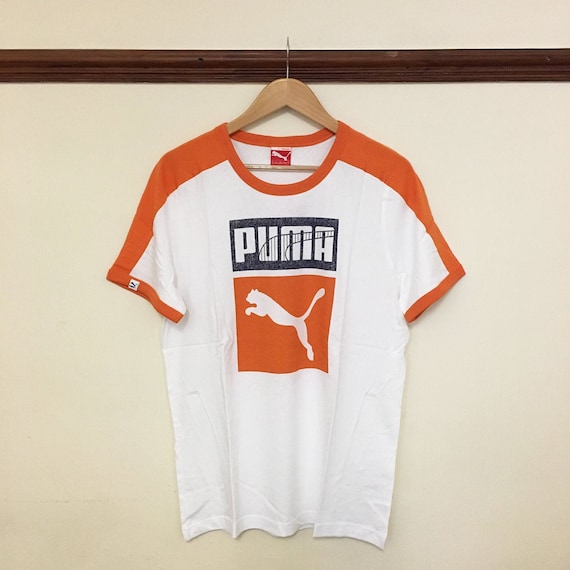 orange puma shirt