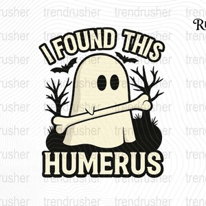 May include: A Halloween-themed graphic featuring a cartoon ghost holding a bone, with the text "I FOUND THIS HUMERUS." The design includes bats and stylized trees, all in a black and cream color scheme.