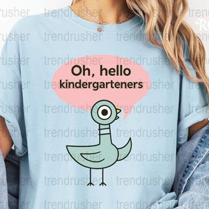 Cute Duck Teacher T-shirt, Oh Hello Kindergarteners, Trendy Graphic Tee, Light Blue Casual Top for Educators