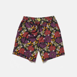 These Purple Tropical Floral shorts have a casual fit with two front pockets, one back pocket, and a drawcord for adjustability. They are made from a single layer of 100% Peached Cotton and woven using a Poplin weave.