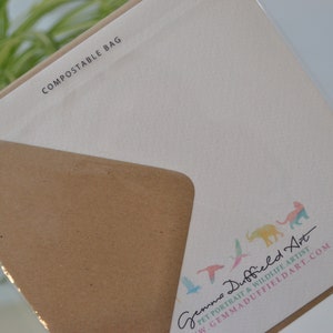 May include: A white card with the text "COMPOSTABLE BAG" printed in black at the top. The bottom of the card features a colorful illustration of animals and birds with the text "Gemma Duffield Art" and "PET PORTRAIT & WILDLIFE ARTIST" in black. The text "GEMMADUFFIELDART.COM" is printed in black below the artist's name.