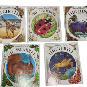 May include: Five children's books with colourful illustrations of animals. The books are titled "The Giraffe", "The Ladybug", "The Hippo", "The Squirrel", and "The Turtle".