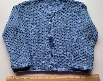 Child size 3, hand knit cardigan sweater.  Medium blue color.  55% cotton, 45 acrylic