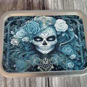 skull tobacco tin This hand painted is now FOR SALE! Shop my available pieces now at www.Frankenfrecklekustoms.com More to come, tomorrow! #frankenfrecklekustoms #artist #handpainted #tobacco #smokingkills Blue Fairy Skull 2oz Silver