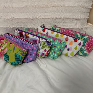 Small zipper pouch featuring Tula Pink fabric