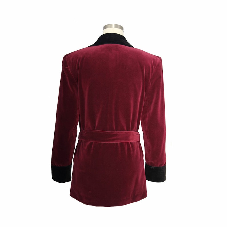 May include: A burgundy velvet robe with a black velvet collar and cuffs. The robe has a self-tie belt.