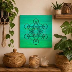 Peut inclure: Une toile murale carrée présentant un motif géométrique noir du Cube de Métatron centré sur un fond vert texturé et vibrant. L'œuvre affiche des lignes et des cercles entrelacés complexes formant un motif de géométrie sacrée détaillé.