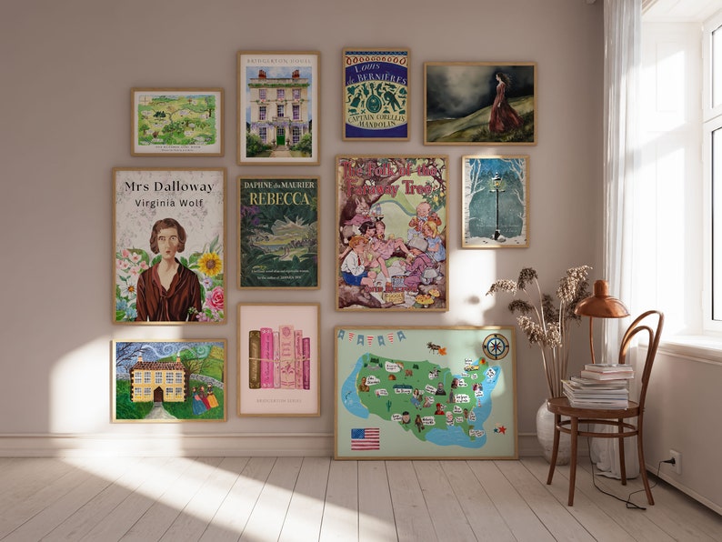 May include: A wall gallery featuring framed prints of book covers, including "Mrs. Dalloway" by Virginia Woolf, "Rebecca" by Daphne du Maurier, and "The Talk of the Town" by  Captain Corelli's Mandolin. The gallery also includes a map of the United States, a vintage illustration of a house, and a vintage illustration of a street lamp.