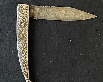 Oriental indo persian ottoman gold and silver damascened koftgari folding damascus knife with a watered steel damascus blade.