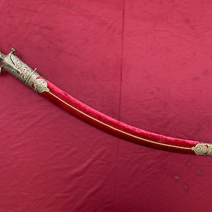 Traditional Indian talwar/sword kirpan with pierced hilt,locket and chape with gold koftgari and damascus steel blade.