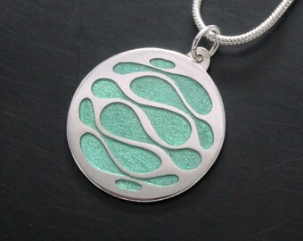 Psychedelic green pendant in 925 silver and UV resin