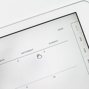 May include: A white digital calendar with the year 2020 printed at the top. The calendar shows the days of the week, Saturday and Sunday, with the numbers 2, 3, 9, and 10 printed on the calendar. A small icon of a sun behind a cloud with rain drops is drawn on the calendar next to the number 3.