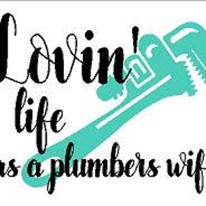 May include: A teal blue wrench with the text "Lovin' life as a plumbers wife" in black.