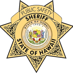 May include: A gold star-shaped badge with the words "Public Safety Sheriff State of Hawaii" and the state seal of Hawaii. The seal features a shield with a red, white, and blue design and the words "Ua Mau Ke Ea O Ka Aina I Ka Pono" in a circle around the shield.