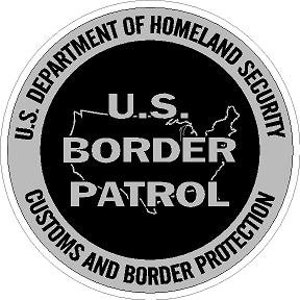 May include: Black and white circular sticker with the text "U.S. BORDER PATROL" and the words "U.S. DEPARTMENT OF HOMELAND SECURITY CUSTOMS AND BORDER PROTECTION" around the outside.