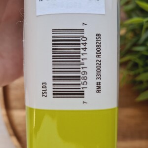 May include: A yellow tube with a white label. The label has the text "ZSLD3" and a barcode. The text "RM# 3310022 RD00821SB" is also on the label.