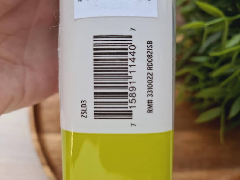May include: A yellow tube with a white label. The label has the text "ZSLD3" and a barcode. The text "RM# 3310022 RD00821SB" is also on the label.