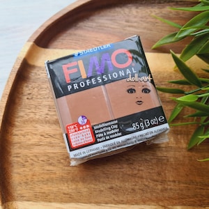May include: A package of FIMO Professional Modeling Clay in the color dollart. The package is 85 grams (3 ounces) and is made in Germany. The clay is oven-bake and can be used for a variety of projects.