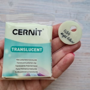 May include: A package of translucent polymer clay in a light green color. The package is labeled "CERNIT® TRANSLUCENT" and includes the text "024 Night Glow".