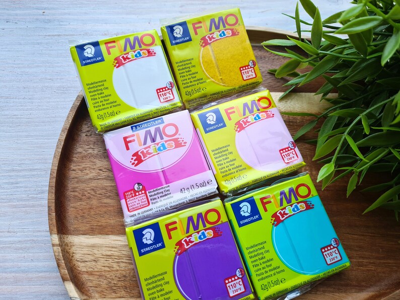 May include: Five different colors of Fimo Kids oven-bake modeling clay. The colors are white, pink, yellow, light pink, and turquoise. Each package is 42 grams (1.5 ounces).