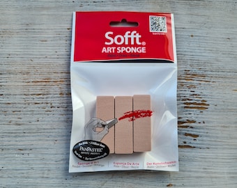 May include: Three rectangular brown art sponges in a clear plastic package. The package has a red header with the text "Sofft. ART SPONGE Paint Draw Blend" and a QR code. The text "Use with: A utiliser Avec PANPASTEL ARTISTS PASTELS" is printed on the bottom of the package.