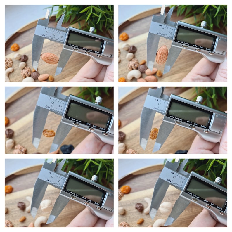 May include: A silver digital caliper measuring the size of a variety of nuts, including almonds, cashews, and peanuts. The caliper has a digital display that shows the measurement in inches and millimeters.