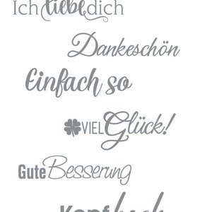 Puede incluir: Una colecci&oacute;n de seis frases grises escritas a mano en una fuente cursiva. Las frases son: "Ich liebe dich", "Dankesch&ouml;n", "einfach so", "viel Gl&uuml;ck!", "Gute Besserung" y "Kopf hoch".