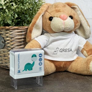 Timbro tessile per bambini con motivo Dinosaur01 e personalizzazione (47 x 18 mm)
