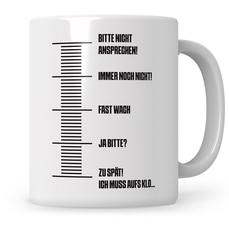 May include: White ceramic mug with black text that reads "Bitte nicht ansprechen! Immer noch nicht! Fast wach Ja bitte? Zu sp&auml;t! Ich muss aufs Klo..." The text is arranged vertically on the mug, with a black line separating each phrase.