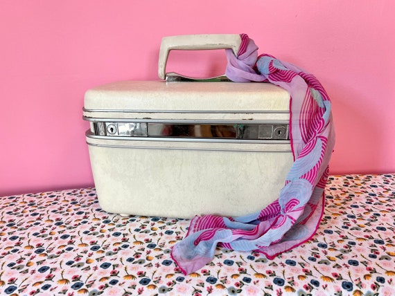 Cute pink and purple travel makeup storage train case 