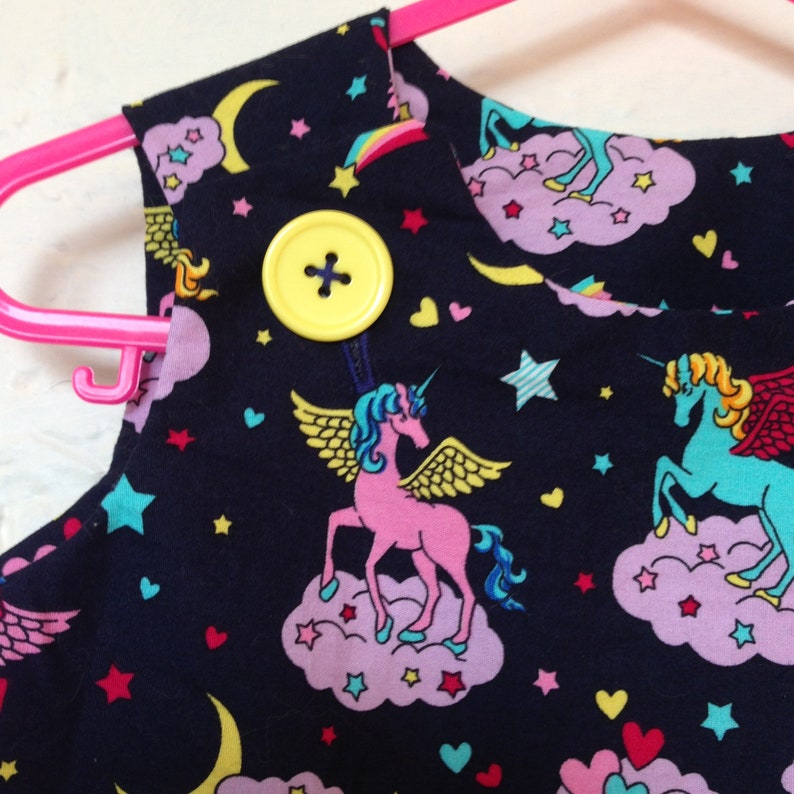 Unicorn Pinafore, AU size 2, gorgeous unicorn/Pegasus fabric in midnight blue. image 1