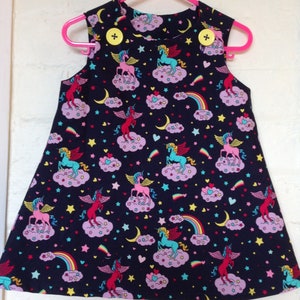 Unicorn Pinafore, AU size 2, gorgeous unicorn/Pegasus fabric in midnight blue. image 2