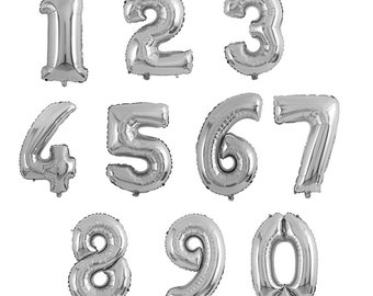 May include: Ten silver foil balloons, each shaped like a number from 1 to 10. The balloons are inflated and ready to be used for a party or celebration.