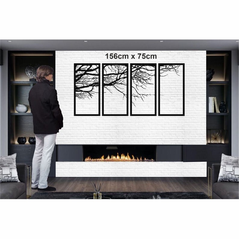 May include: Black metal wall art featuring four panels with a silhouette of tree branches. The art is 156cm x 75cm and is displayed on a white brick wall above a fireplace.