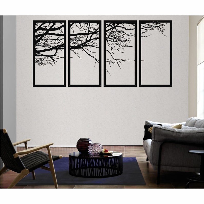 May include: Four black metal wall art pieces with a silhouette of tree branches against a white background. The art pieces are arranged in a row on a white wall.