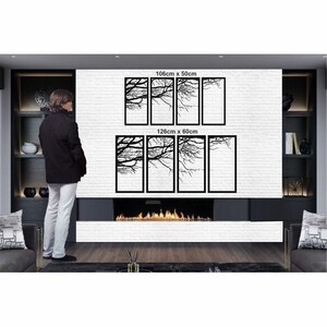 May include: A set of six black metal wall art panels featuring a silhouette of tree branches. The panels are arranged in two rows of three, with the top row measuring 106cm x 50cm and the bottom row measuring 126cm x 60cm.