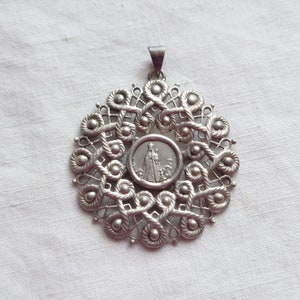 Religious silver pendant with a medal of the Virgin