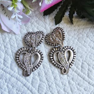 Jacky de G | Vintage clip-on earrings in silver metal and rhinestones, French designer, luxury, France