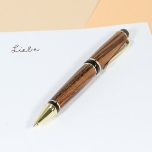 handmade precious wood ballpoint pen, hand-turned ballpoint pen made of zebrawood goldfarben