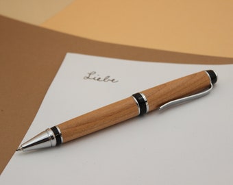handmade executive ballpoint pen made of cherry wood