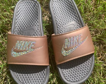 gold nike slippers