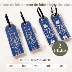 May include: Four blue rectangular tags with a white nutcracker design and black metal loops. The tags have the text "DIGITAL DOWNLOAD FILE" and the number "2 FILES".