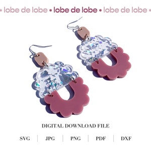 May include: A pair of pink and clear iridescent earrings with a scalloped edge. The earrings are made of acrylic and have a unique design.
