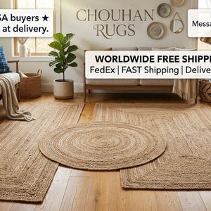 May include: A collection of natural fiber rugs featuring a rectangular runner, a large rectangular rug, and a circular rug, all with a braided texture. The text CHOUHAN RUGS is visible on the wall above a sofa in a room with wooden flooring.